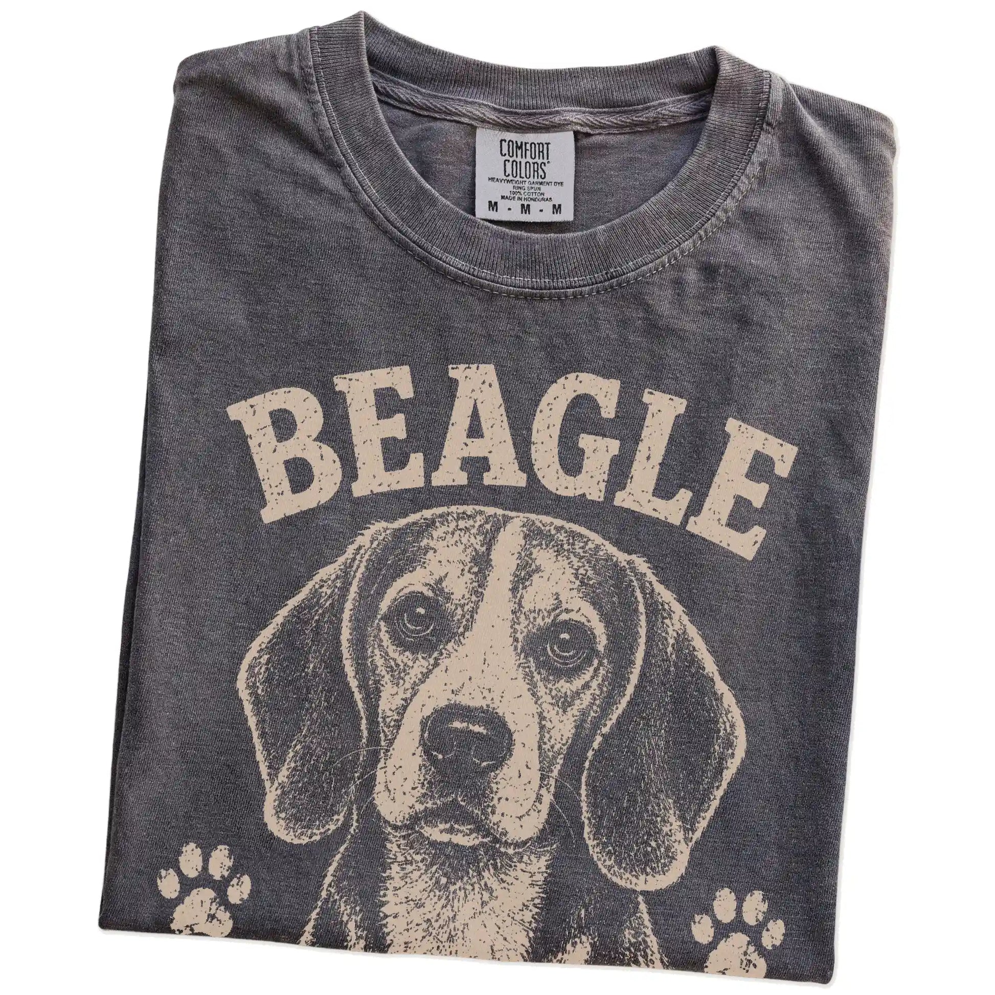 Folded Pepper Comfort Colors® T-shirt showing Beagle design with “I Follow My Nose & My Own Rules” lettering