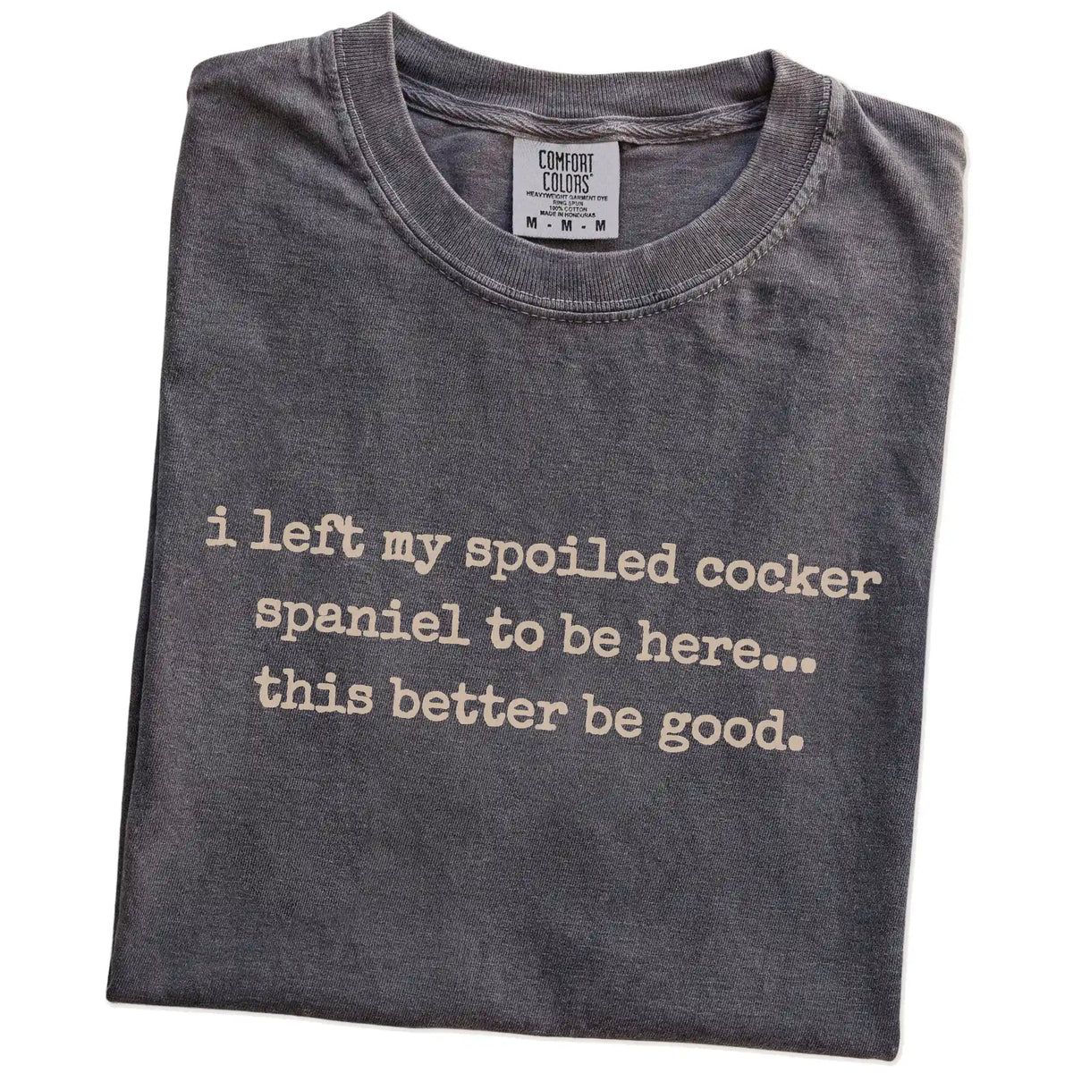 Folded Pepper Comfort Colors® T-shirt showing the “I Left My Spoiled Cocker Spaniel Home” saying