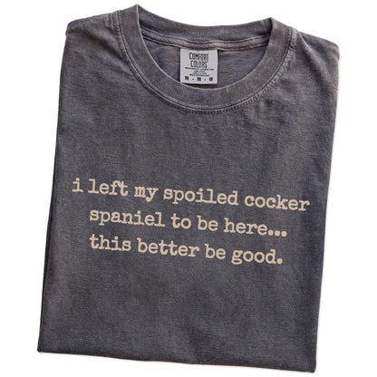 Folded Pepper Comfort Colors® T-shirt showing the “I Left My Spoiled Cocker Spaniel Home” saying