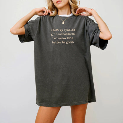 Model wearing a Pepper Comfort Colors® T-shirt featuring Goldendoodle “I Left My Spoiled Dog Home” saying