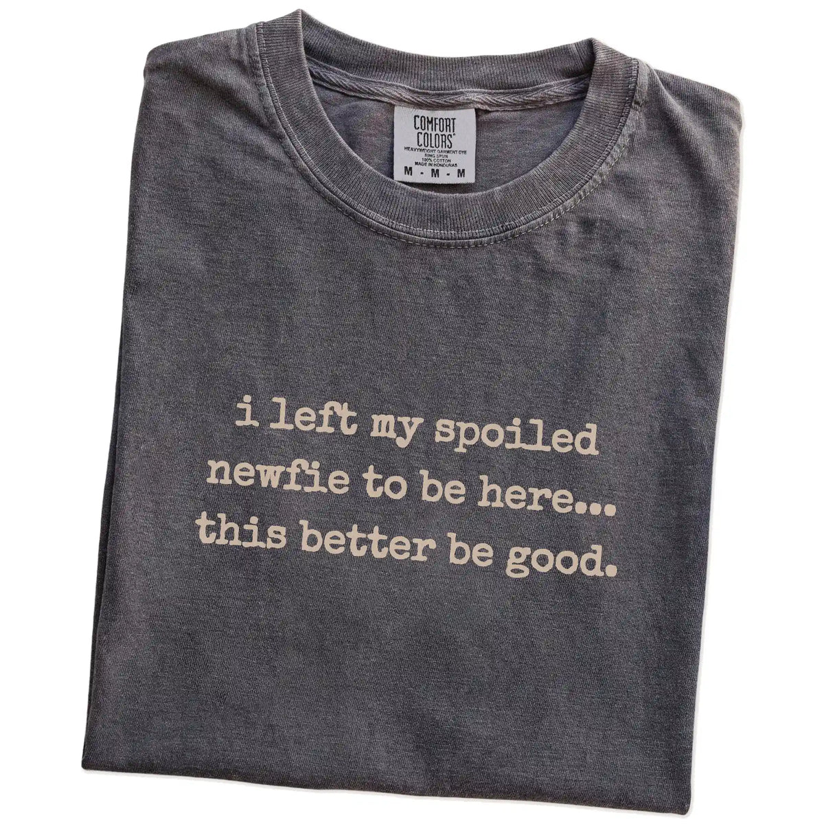 Folded Pepper Comfort Colors® T-shirt showing the “I Left My Spoiled Newfie Home” saying
