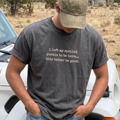 Model wearing a Pepper Comfort Colors® T-shirt featuring the “I Left My Spoiled Yorkie Home” saying