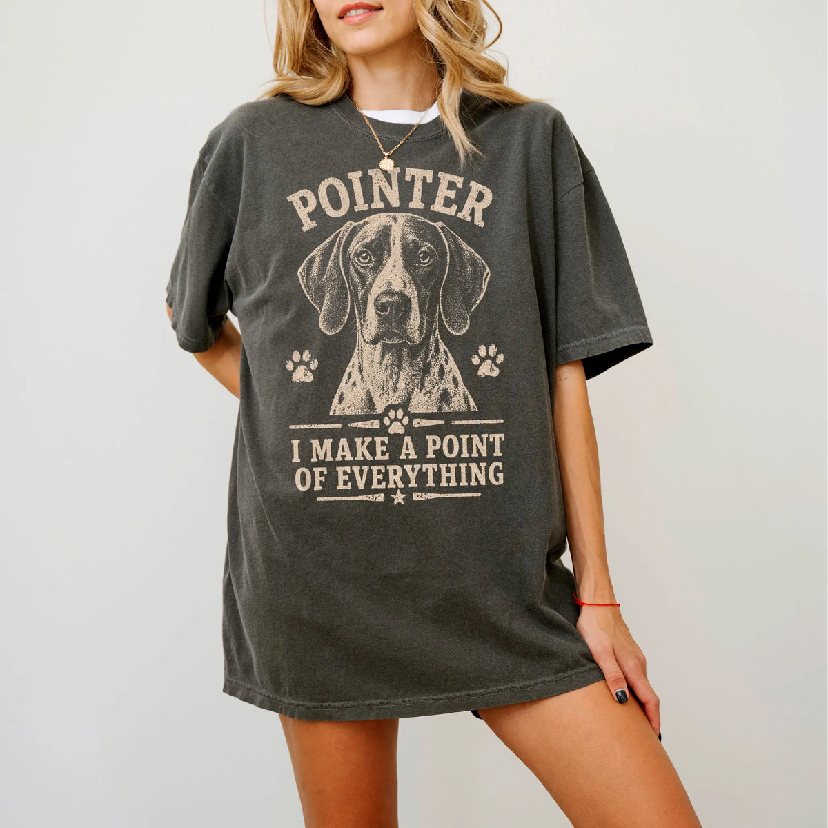 Model wearing a Pepper Comfort Colors® T-shirt featuring Pointer design with “I Make A Point Of Everything” lettering