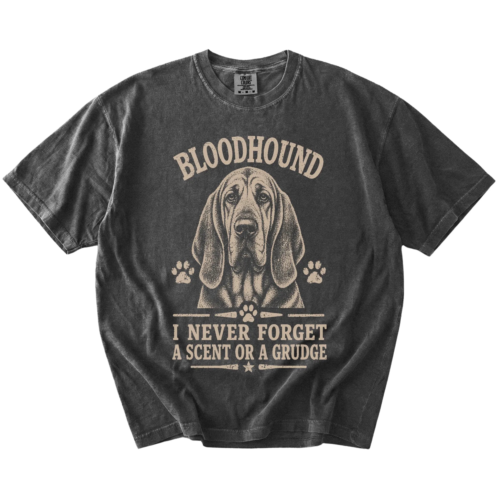 Bloodhound design with “I Never Forget A Scent Or A Grudge” lettering on a Pepper Comfort Colors® T-shirt
