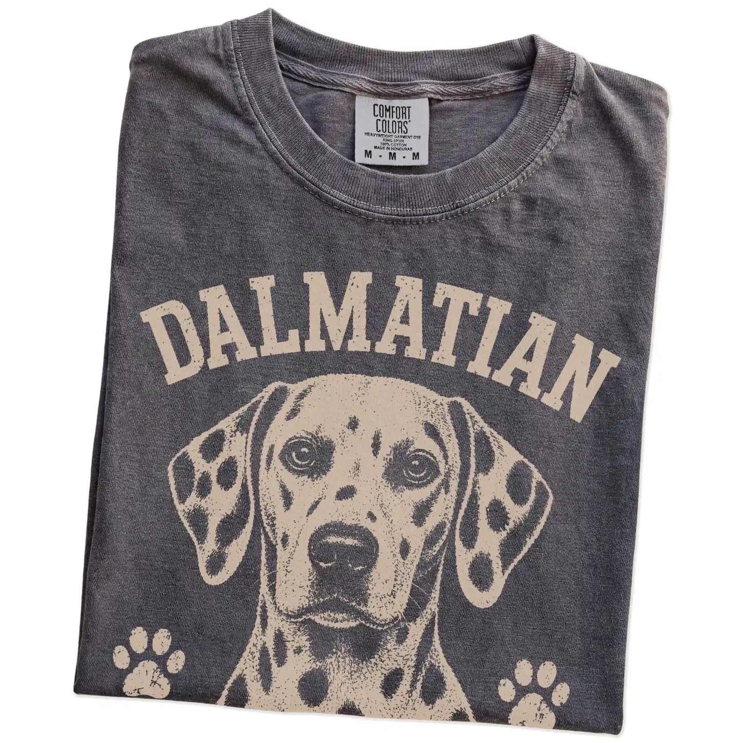 Folded Pepper Comfort Colors® T-shirt showing Dalmatian design with “I Stand Out On Purpose” lettering