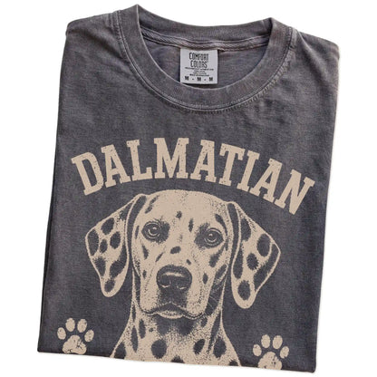 Folded Pepper Comfort Colors® T-shirt showing Dalmatian design with “I Stand Out On Purpose” lettering