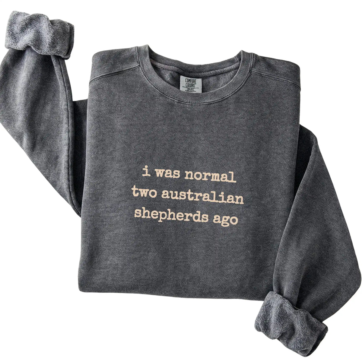 Pepper I Was Normal Two Australian Shepherds Ago Comfort Colors sweatshirt folded to show the printed design