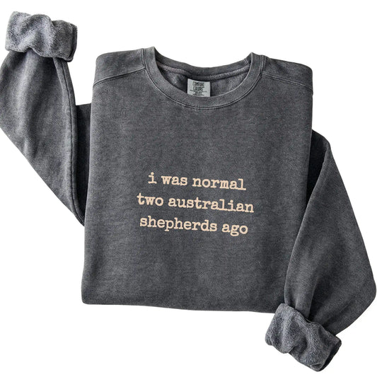 Pepper I Was Normal Two Australian Shepherds Ago Comfort Colors sweatshirt folded to show the printed design