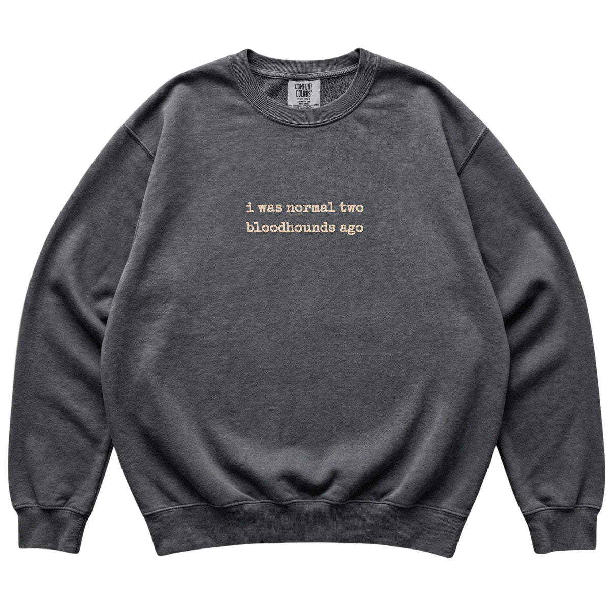 Pepper I Was Normal Two Bloodhounds Ago Comfort Colors sweatshirt laid flat