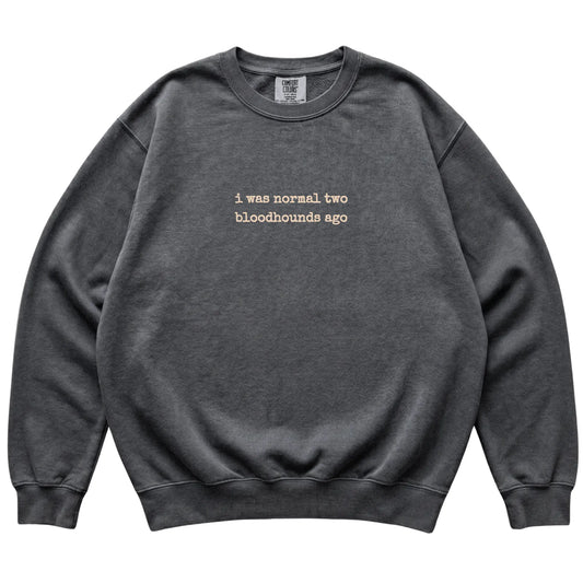 Pepper I Was Normal Two Bloodhounds Ago Comfort Colors sweatshirt laid flat