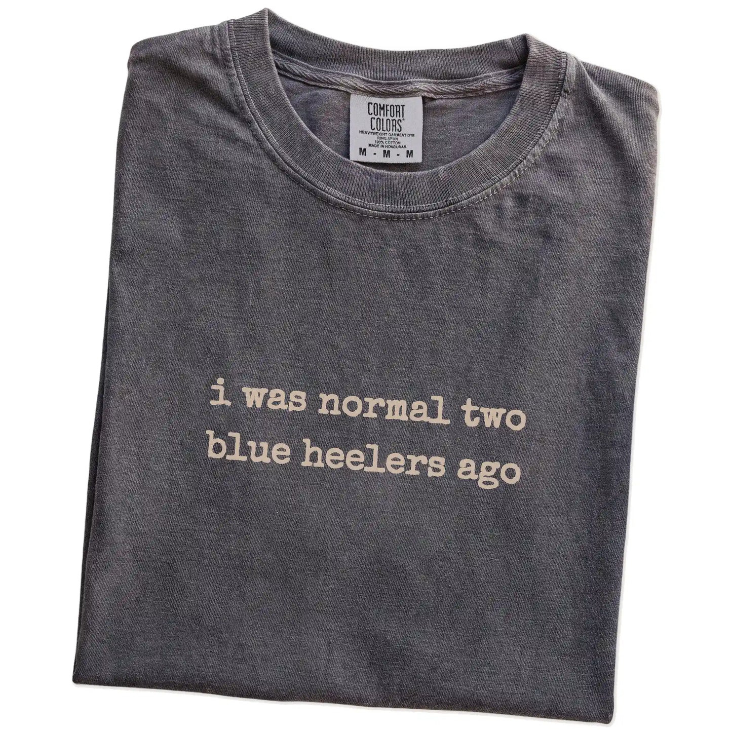 Folded Pepper Comfort Colors® T-shirt showing i was normal two blue heelers ago lettering