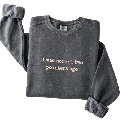 Pepper I Was Normal Two Pointers Ago Comfort Colors sweatshirt folded to show the printed design