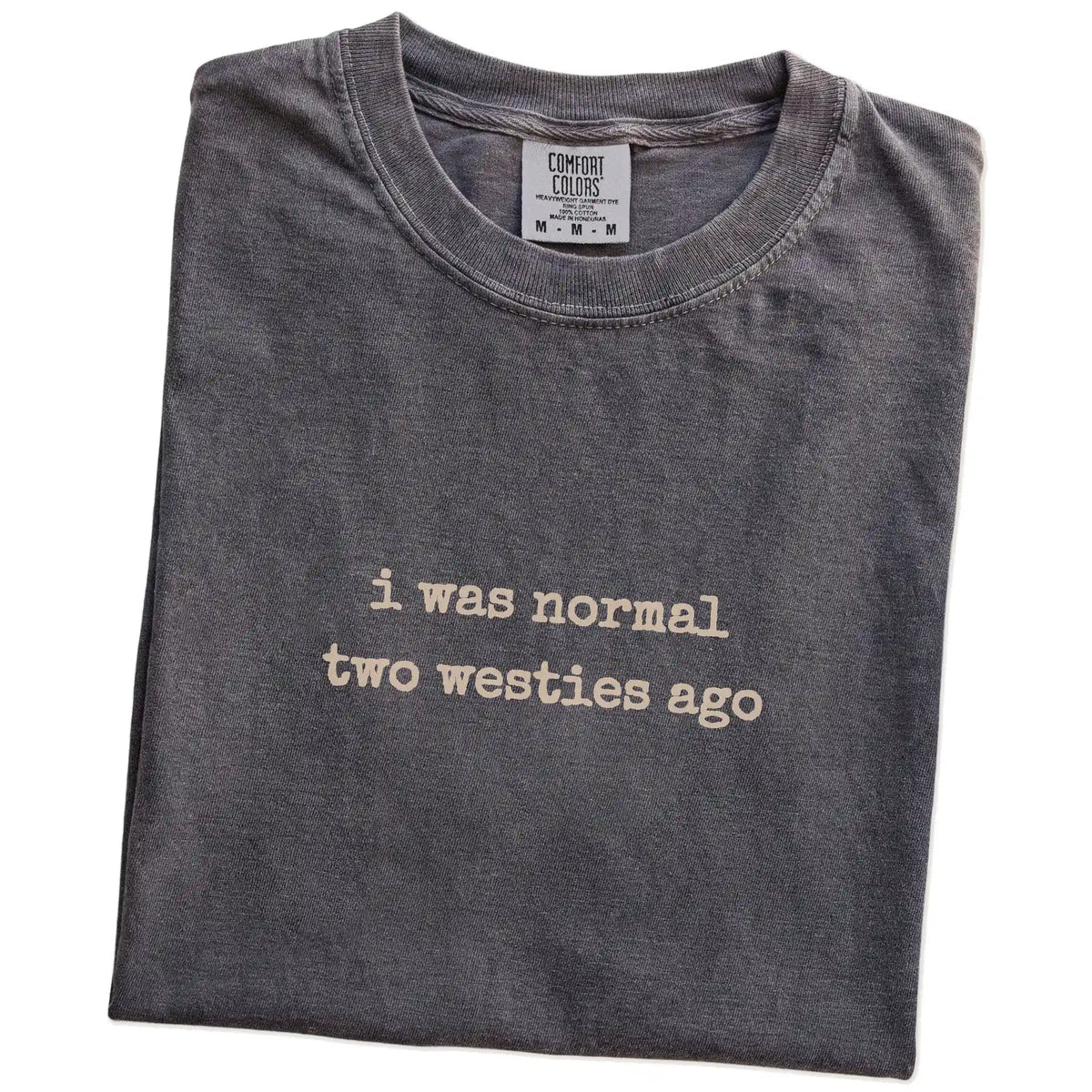 Folded Pepper Comfort Colors® T-shirt showing i was normal two westies ago lettering