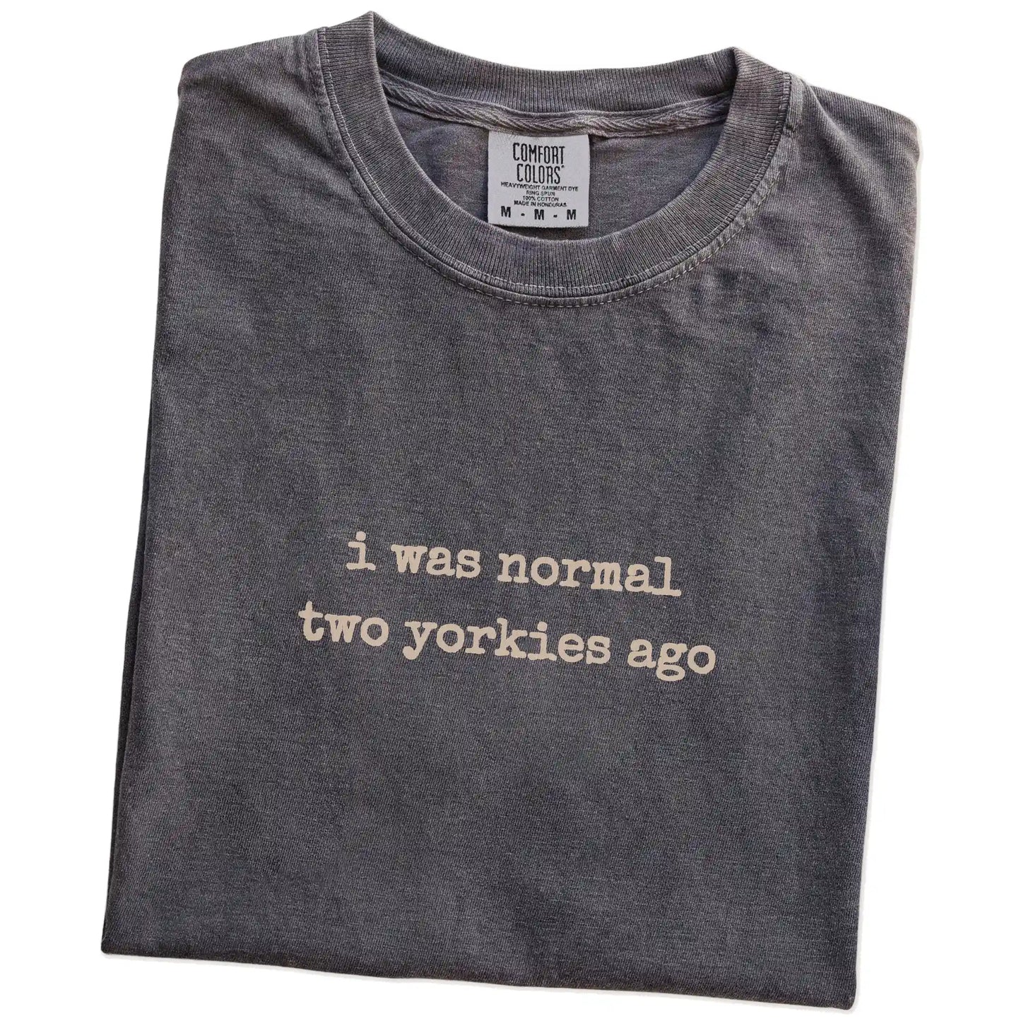 Folded Pepper Comfort Colors® T-shirt showing i was normal two yorkies ago lettering