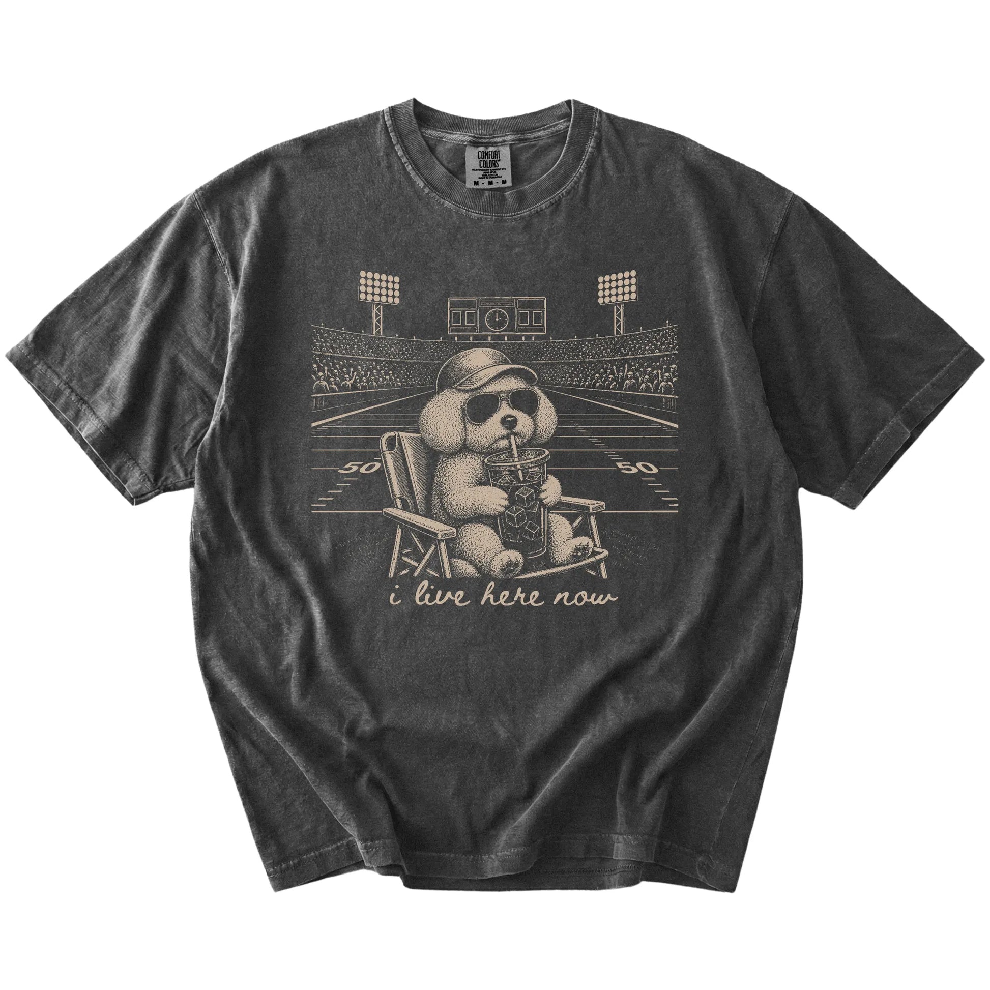 Bichon Frise claiming the football field with “I Live Here Now” lettering on a Pepper Comfort Colors® T-shirt