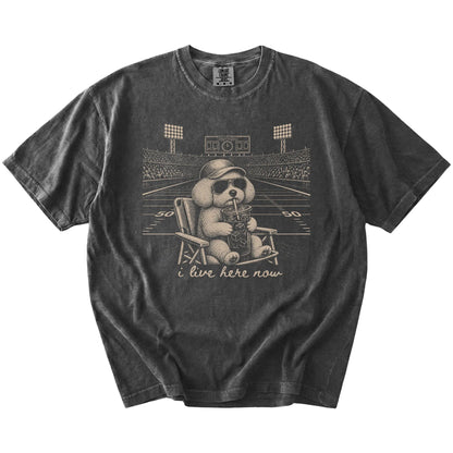 Bichon Frise claiming the football field with “I Live Here Now” lettering on a Pepper Comfort Colors® T-shirt