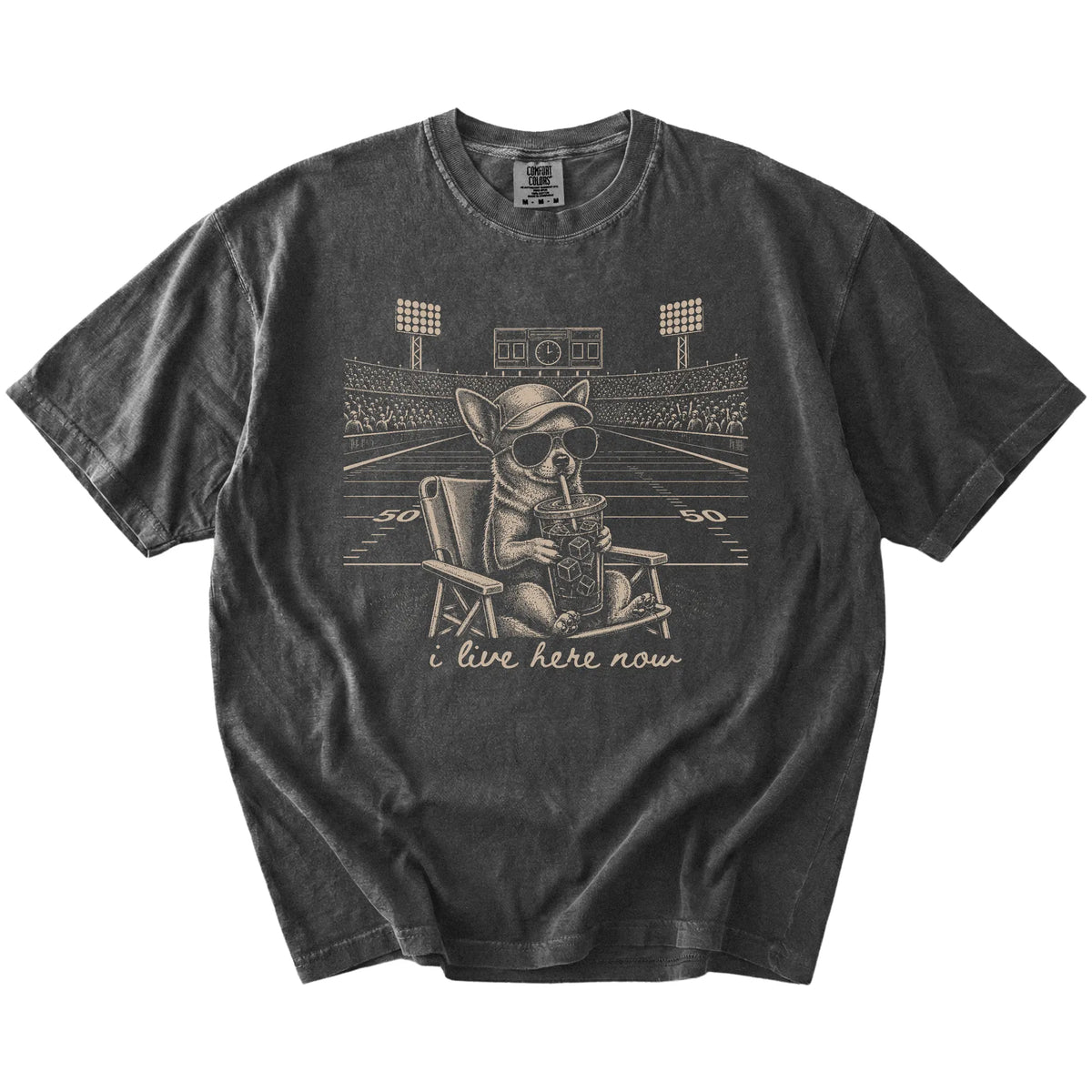Chihuahua claiming the football field with “I Live Here Now” lettering on a Pepper Comfort Colors® T-shirt