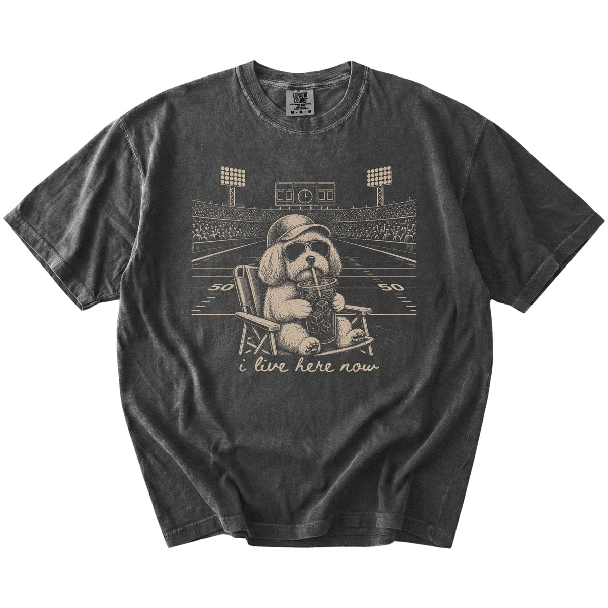 Havanese claiming the football field with “I Live Here Now” lettering on a Pepper Comfort Colors® T-shirt