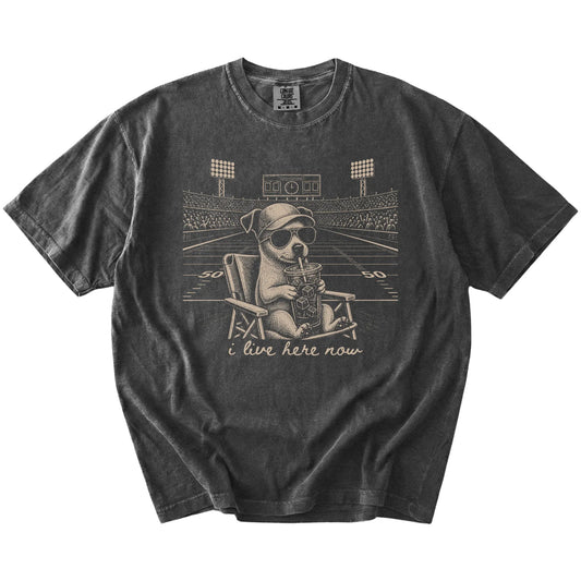 Jack Russell claiming the football field with “I Live Here Now” lettering on a Pepper Comfort Colors® T-shirt