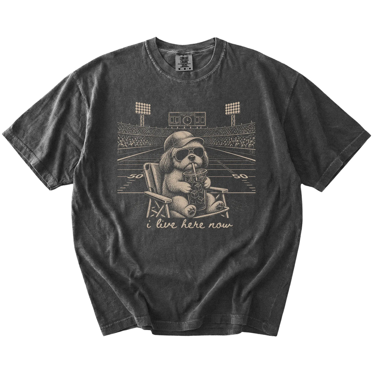Shih Tzu claiming the football field with “I Live Here Now” lettering on a Pepper Comfort Colors® T-shirt