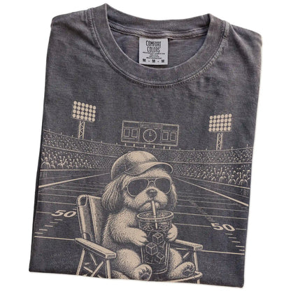 Folded Pepper Comfort Colors® T-shirt showing Shih Tzu claiming the football field with “I Live Here Now” lettering