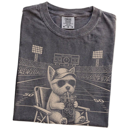Folded Pepper Comfort Colors® T-shirt showing Westie claiming the football field with “I Live Here Now” lettering