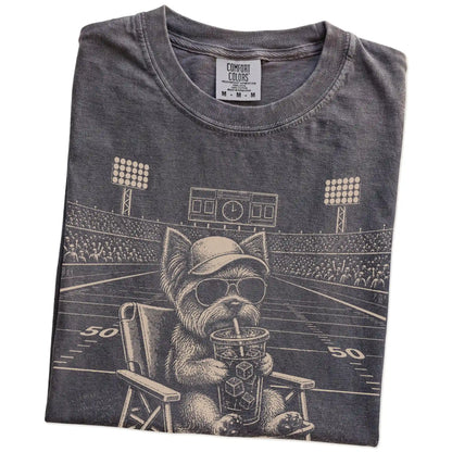 Folded Pepper Comfort Colors® T-shirt showing Yorkie claiming the football field with “I Live Here Now” lettering