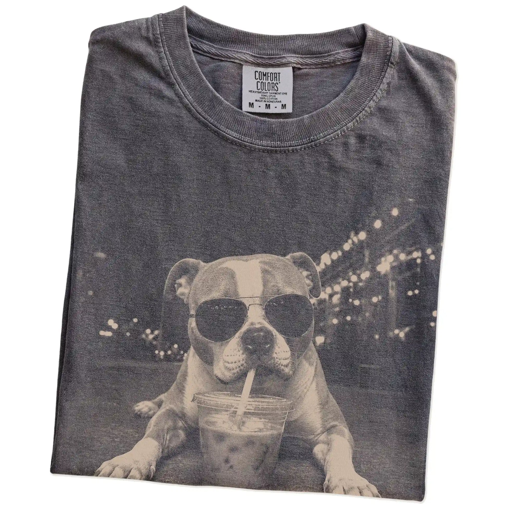 Folded Pepper Comfort Colors® T-shirt showing American Bulldog with iced coffee in a retro grunge design