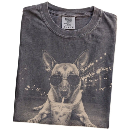 Folded Pepper Comfort Colors® T-shirt showing Belgian Malinois with iced coffee in a retro grunge design