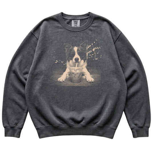 Border Collie wearing aviator sunglasses and drinking iced coffee on a Pepper Comfort Colors 1566 Sweatshirt, flat lay view
