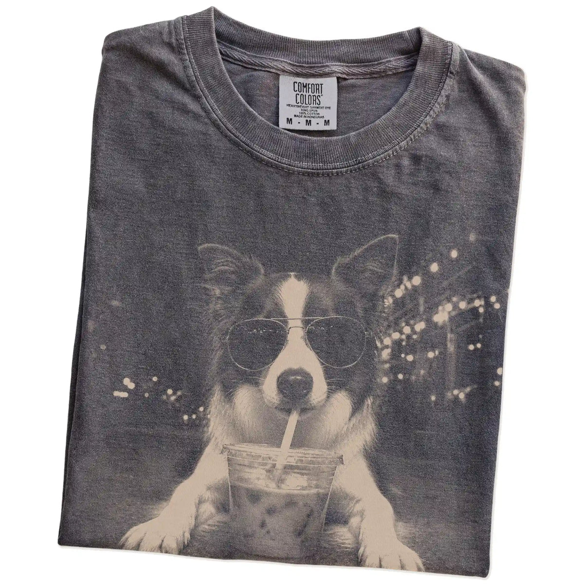 Folded Pepper Comfort Colors® T-shirt showing Border Collie with iced coffee in a retro grunge design