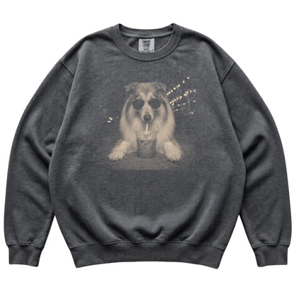 Collie wearing aviator sunglasses and drinking iced coffee on a Pepper Comfort Colors 1566 Sweatshirt, flat lay view