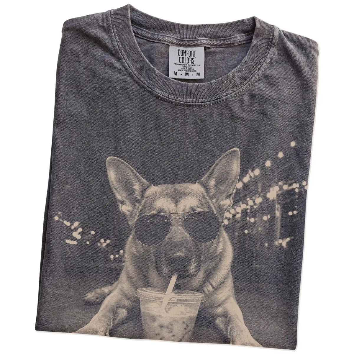 Folded Pepper Comfort Colors® T-shirt showing German Shepherd with iced coffee in a retro grunge design
