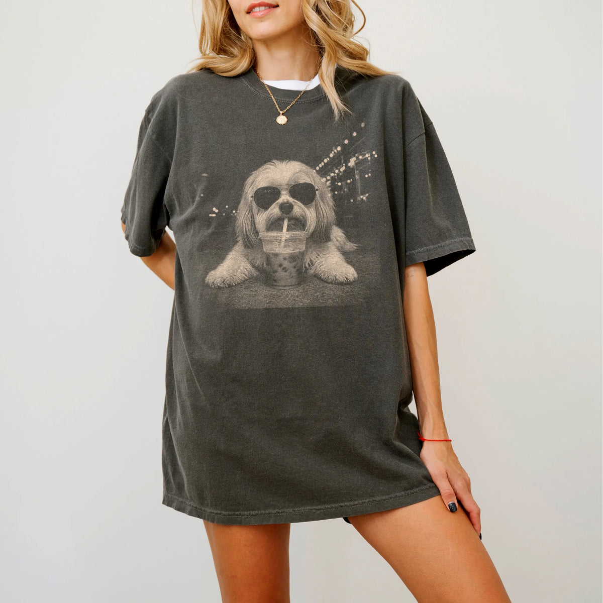 Model wearing a Pepper Comfort Colors® T-shirt featuring Havanese with iced coffee in a retro grunge design