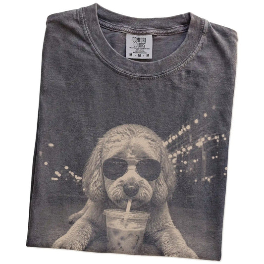 Folded Pepper Comfort Colors® T-shirt showing Labradoodle with iced coffee in a retro grunge design