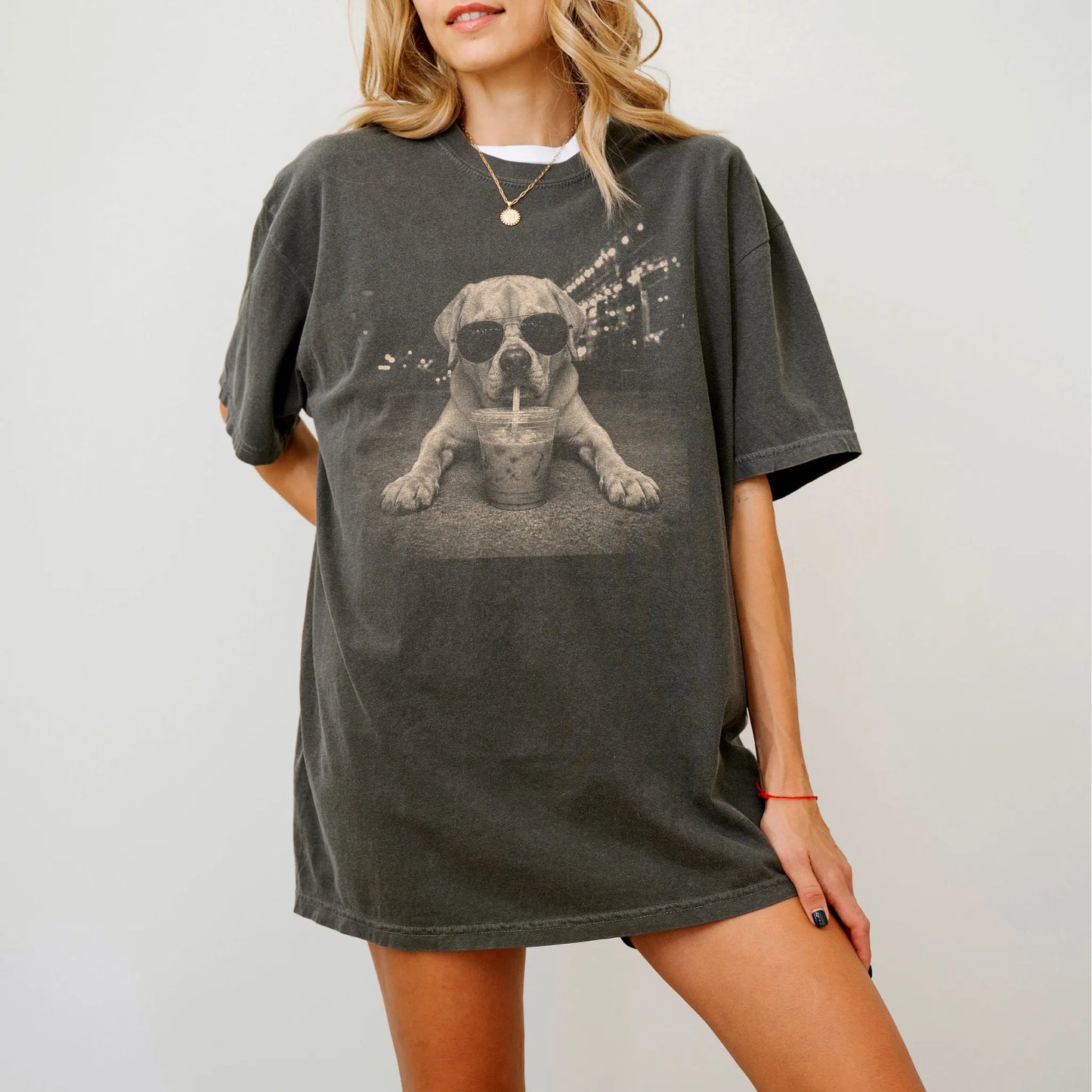 Model wearing a Pepper Comfort Colors® T-shirt featuring Labrador Retriever with iced coffee in a retro grunge design