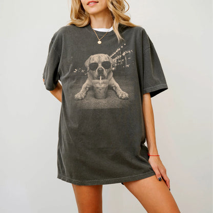 Model wearing a Pepper Comfort Colors® T-shirt featuring Labrador Retriever with iced coffee in a retro grunge design
