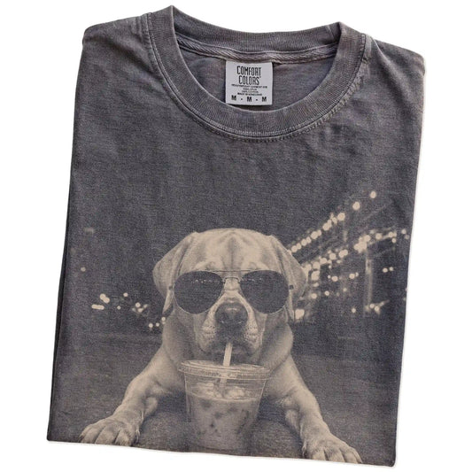 Folded Pepper Comfort Colors® T-shirt showing Labrador Retriever with iced coffee in a retro grunge design