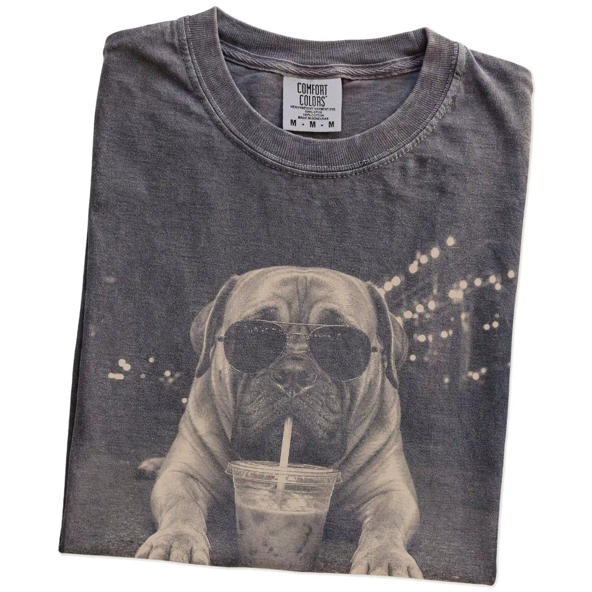 Folded Pepper Comfort Colors® T-shirt showing Mastiff with iced coffee in a retro grunge design