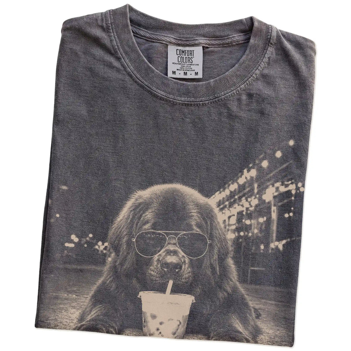 Folded Pepper Comfort Colors® T-shirt showing Newfie with iced coffee in a retro grunge design