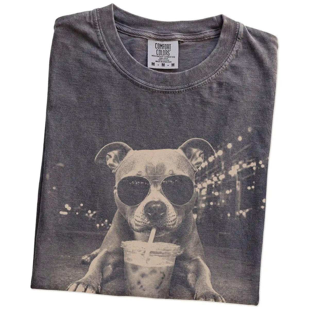 Folded Pepper Comfort Colors® T-shirt showing Pitbull with iced coffee in a retro grunge design