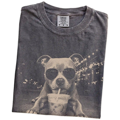 Folded Pepper Comfort Colors® T-shirt showing Pitbull with iced coffee in a retro grunge design