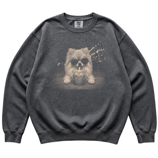 Pomeranian wearing aviator sunglasses and drinking iced coffee on a Pepper Comfort Colors 1566 Sweatshirt, flat lay view