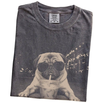 Folded Pepper Comfort Colors® T-shirt showing Pug with iced coffee in a retro grunge design
