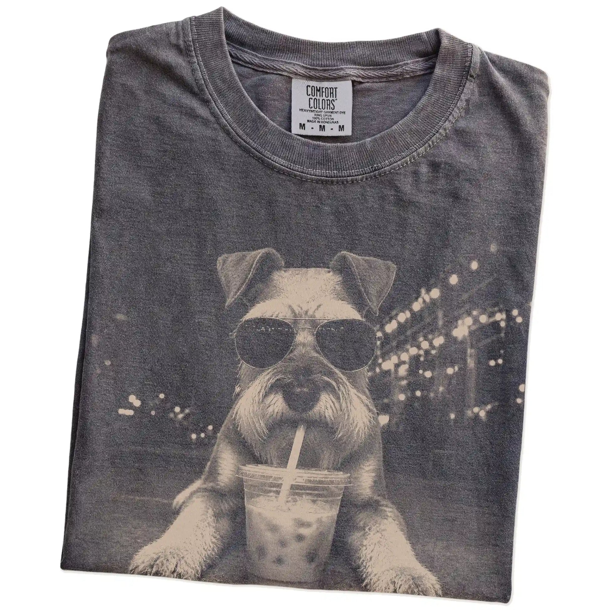 Folded Pepper Comfort Colors® T-shirt showing Schnauzer with iced coffee in a retro grunge design