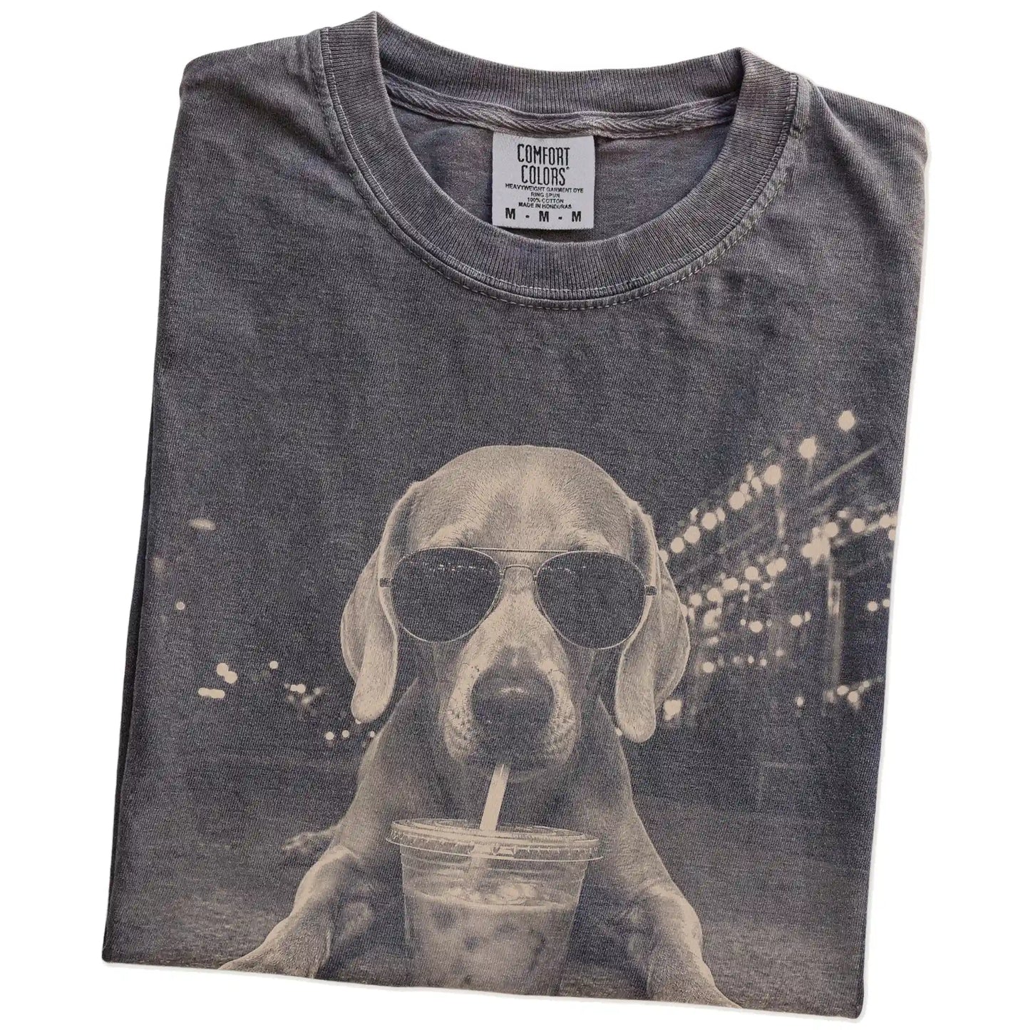 Folded Pepper Comfort Colors® T-shirt showing Weimaraner with iced coffee in a retro grunge design
