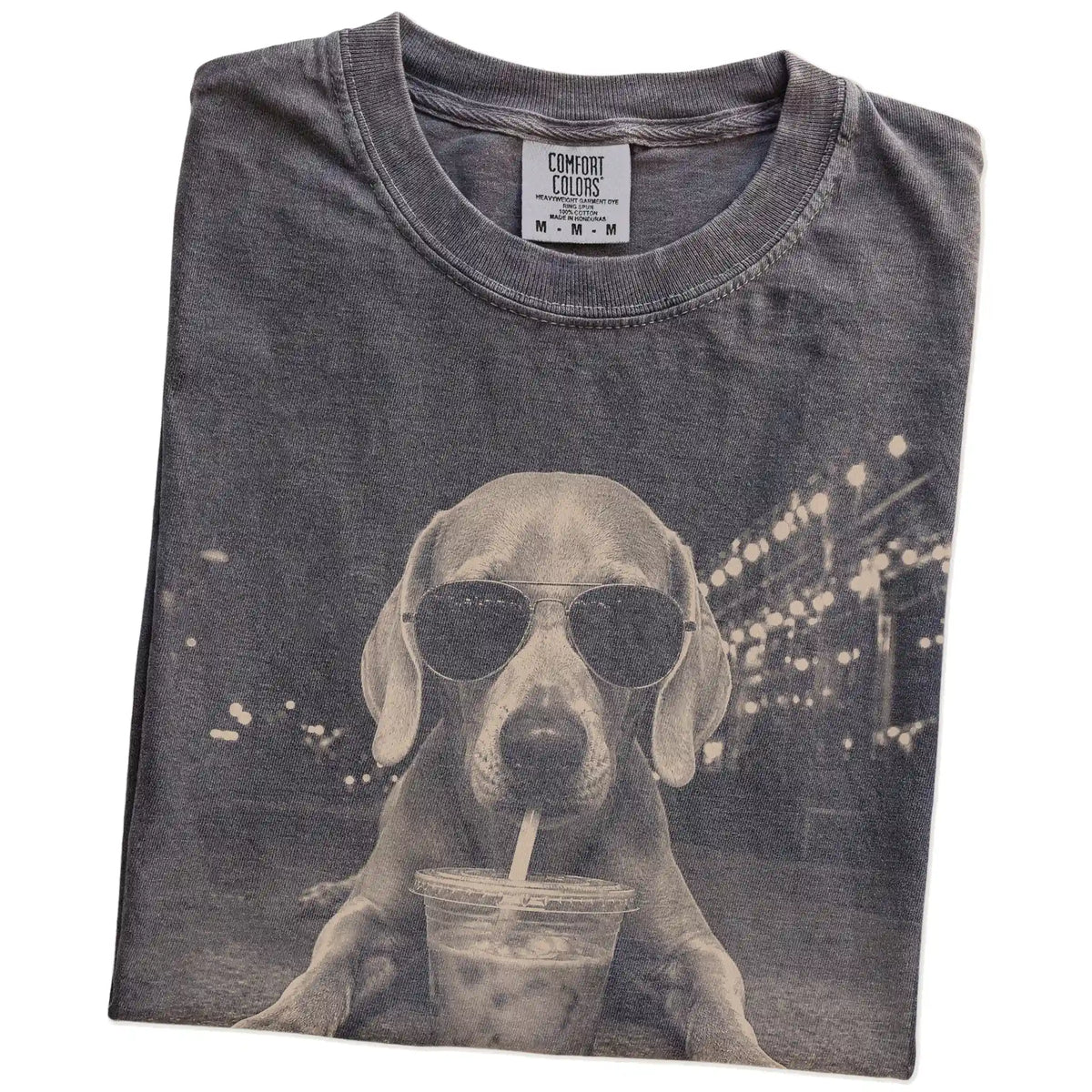 Folded Pepper Comfort Colors® T-shirt showing Weimaraner with iced coffee in a retro grunge design