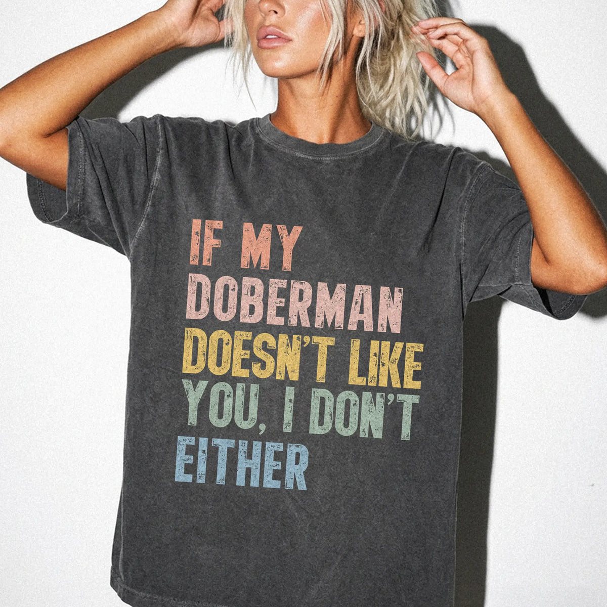 Model wearing a Pepper Comfort Colors® T-shirt featuring Doberman with “If My Dog Doesn’t Like You, I Don’t Either” lettering