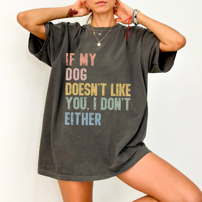Model wearing a Pepper Comfort Colors® T-shirt featuring dogs with “If My Dog Doesn’t Like You, I Don’t Either” lettering