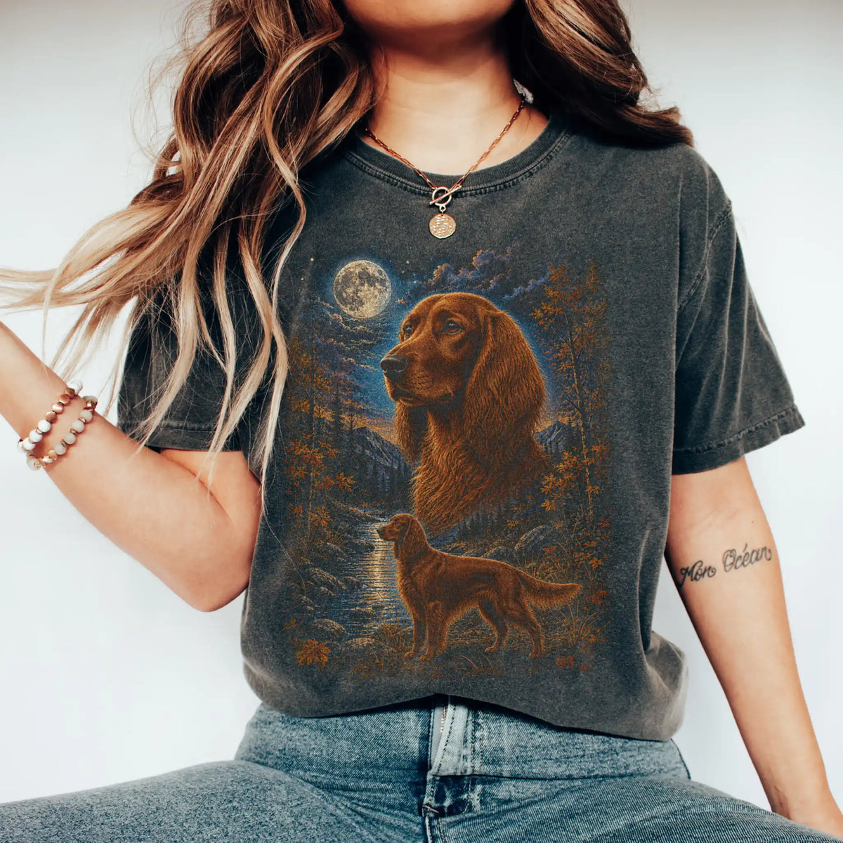 Model wearing a pepper T-shirt with Irish Setter Autumn Moon artwork.